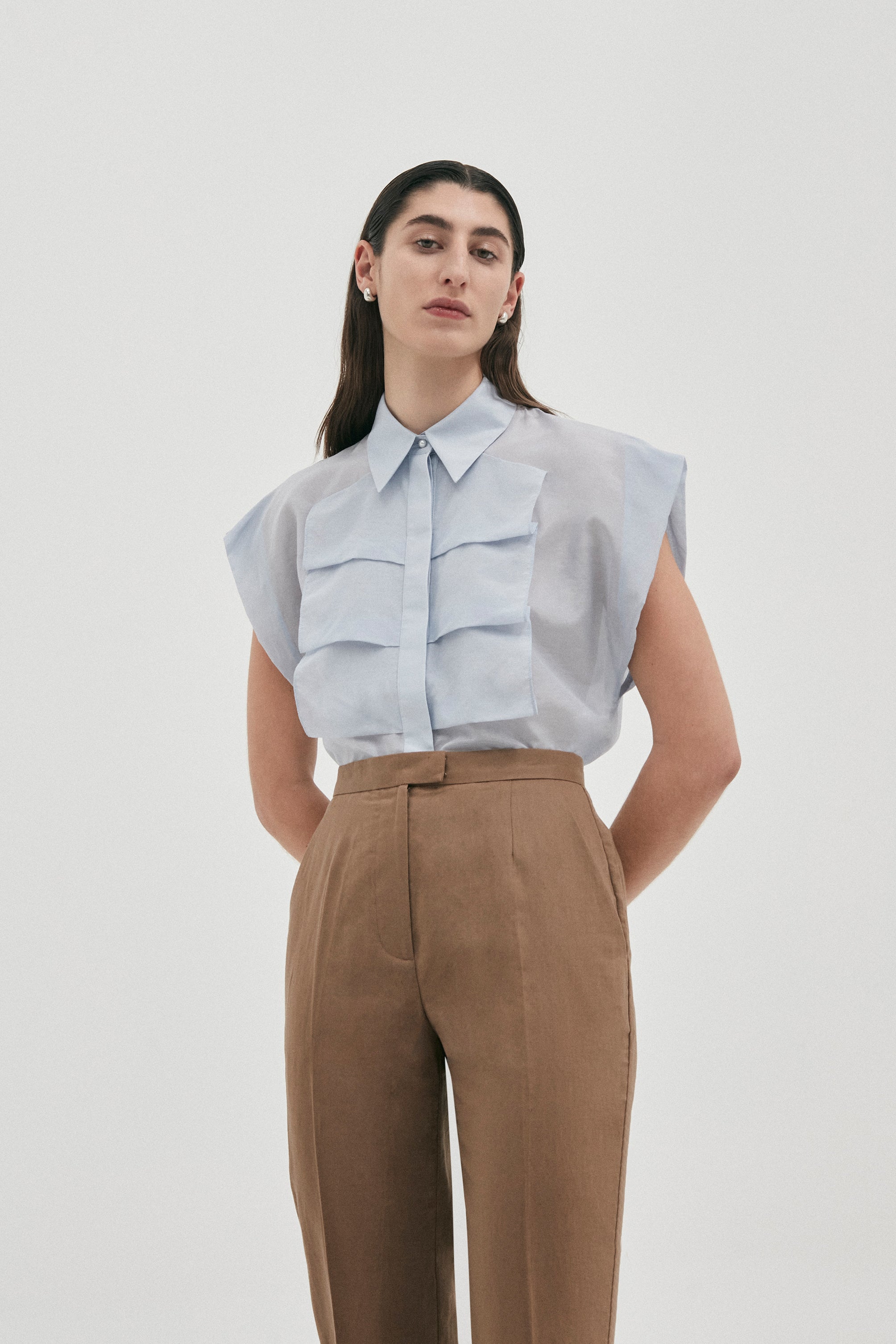 Luxe sleeveless shirt blouse in Cotton | Silk from Australian designer PALMA MARTÎN. Featuring a confident silhouette with wide shoulders, and front ruffle detail.