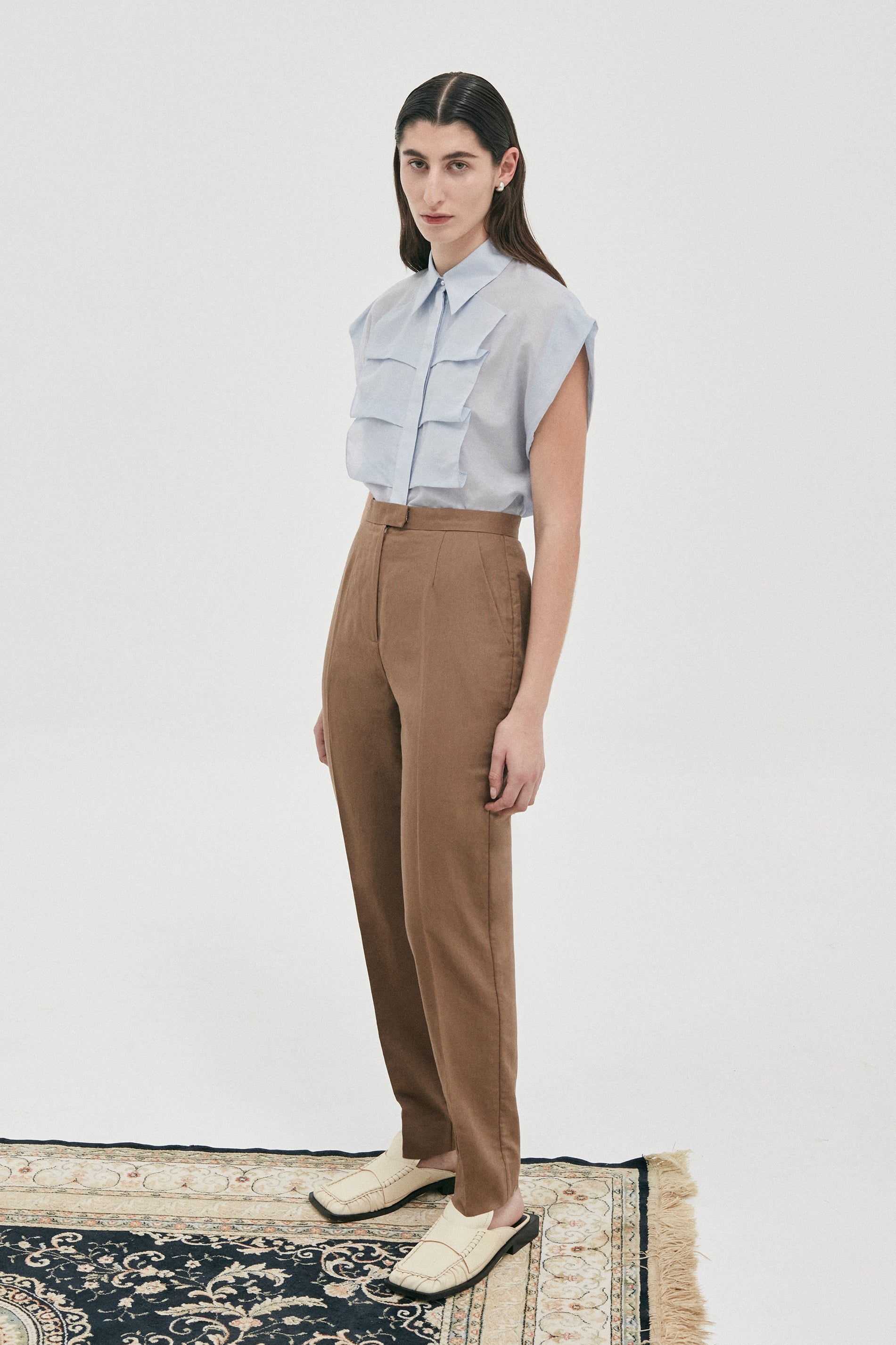 Luxe sleeveless shirt blouse in Cotton | Silk from Australian designer PALMA MARTÎN. Featuring a confident silhouette with wide shoulders, and front ruffle detail.